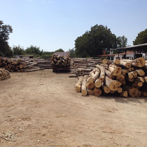 A large collection of recycled pallets waiting to be processed.
